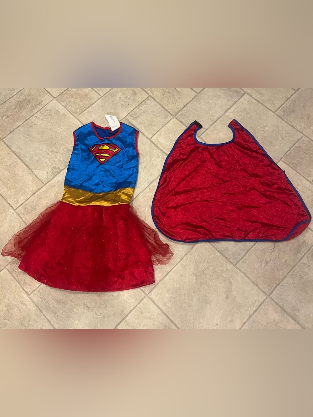 Supergirl costume girl’s size medium. Dress with cape. Sparkly chiffon skirt